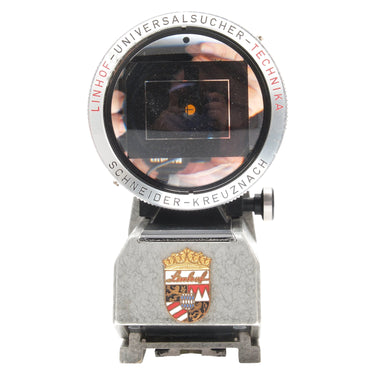 Linhof Universal Finder front view showing viewing window, Linhof crest, and Schneider-Kreuznach engraving