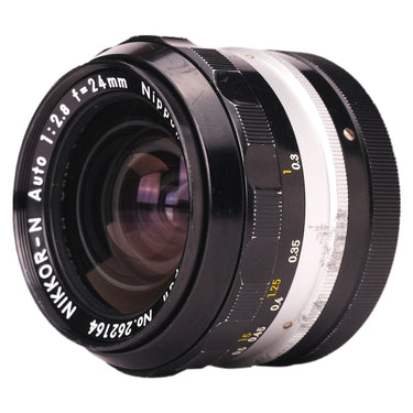 Nikon Nikkor-N 24mm f2.8 front three-quarter view showing focus scale and barrel marks