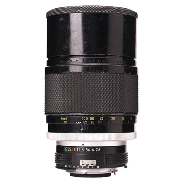 Nikon 180mm f2.8 Nikkor-P lens standing upright showing front barrel and NIKKOR-P Auto engraving