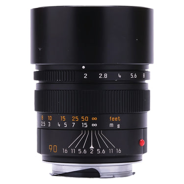 Leica 90mm f2 Summicron-M front view with built-in hood extended and aperture and distance scales