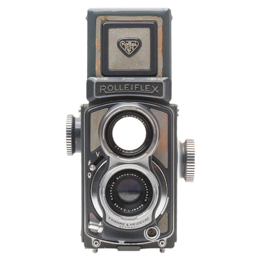 Rollei 4x4 Baby grey TLR front view with Xenar taking lens, Heidosmat viewing lens and Rolleiflex nameplate