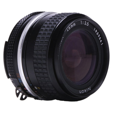 Nikon 28mm f3.5 lens angled front view showing front glass and knurled focus ring