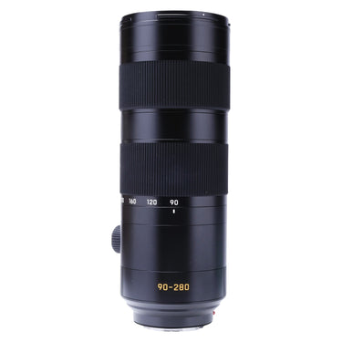 Leica 90-280mm f2.8-4 SL lens standing upright, front three-quarter view with hood