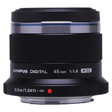 Olympus M.Zuiko Digital 45mm f1.8 side view showing barrel markings and focus scale