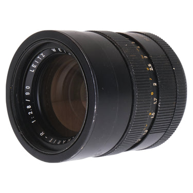 Leica 90mm f2.8 Elmarit-R front three-quarter view showing Leitz Wetzlar 1:2.8/90 engraving