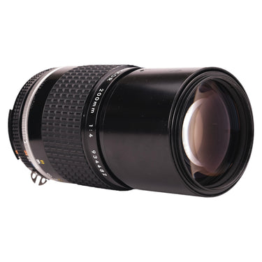 Nikon 200mm f4 Nikkor lens front three-quarter view showing barrel markings and serial