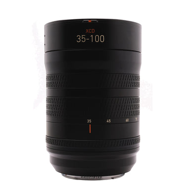 Hasselblad XCD 35-100mm lens front view standing upright with zoom scale and hood