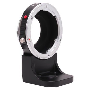 Leica R-Adapter M front showing M-mount bayonet with red index dot, on display stand