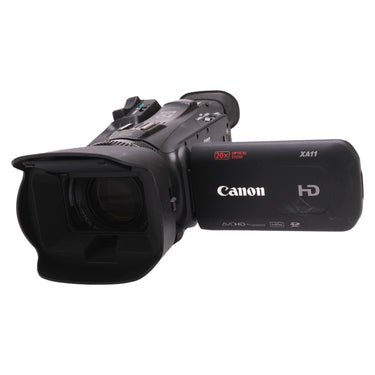 Canon XA20 professional camcorder front three-quarter view with lens hood and open LCD panel