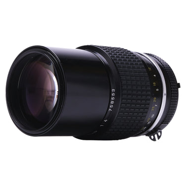 Nikon 200mm f4 AI angled view showing front glass and focus scale