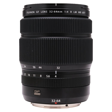 Fujifilm GF 32-64mm F4 R LM WR lens standing upright, front barrel with focal length and aperture markings