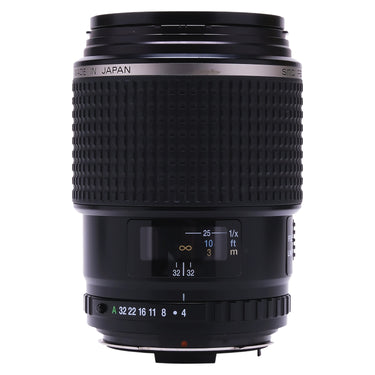 Pentax FA 645 120mm f4 Macro lens standing upright showing distance scale and aperture ring