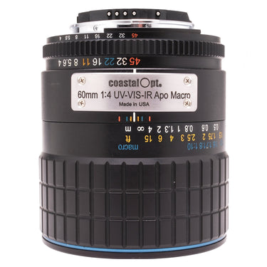 Coastal Optics 60mm f4 UV-VIS-IR Apo Macro lens front three-quarter with aperture scale and nameplate