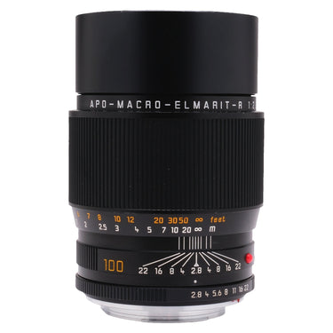 Leica APO-Macro-Elmarit-R 100mm f2.8 standing front view with lens hood and distance scale