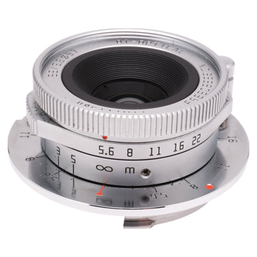 TTArtisan 28mm f5.6 silver front three-quarter view with aperture scale and focus ring
