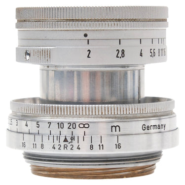 Leica 5cm f2 Summicron collapsible lens side view showing aperture and distance scales with Germany engraving