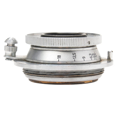 Leica Elmar 3.5cm f3.5 lens side view showing depth of field scale and infinity lock lever