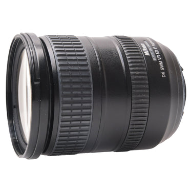 Nikon AF-S 18-200mm lens side view with front cap and Made in Japan engraving