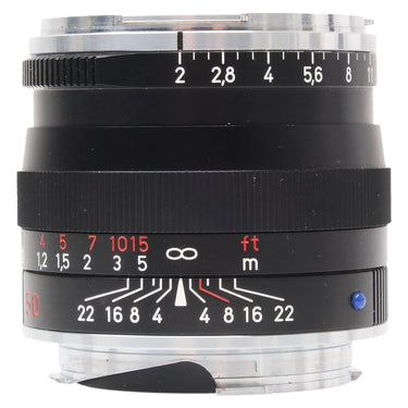 Carl Zeiss Planar 2/50 ZM black lens, side view showing aperture and depth-of-field scales