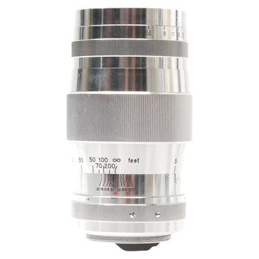 Canon 135mm f3.5 lens side view showing aperture and distance scales