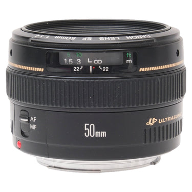 Canon EF 50mm f1.4 USM lens front angled view showing distance scale window and AF/MF switch