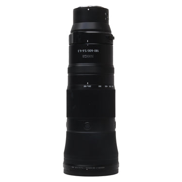 Nikon Z 180-600mm f5.6-6.3 VR lens standing upright, front barrel showing NIKKOR 180-600 marking and zoom scale