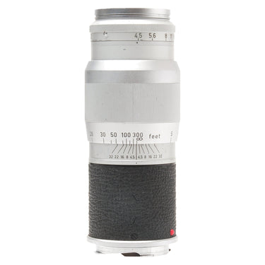 Leica 13.5cm f4.5 Hektor lens standing upright, side view with aperture and depth-of-field scales