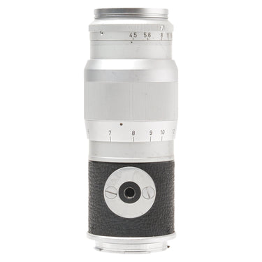 Leica 13.5cm f4.5 Hektor lens standing upright, opposite side showing focus scale and mount screw