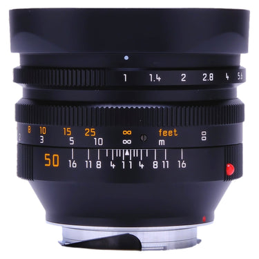 Leica 50mm f1 Noctilux-M front view with mounted metal hood and aperture scale