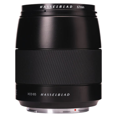 Hasselblad XCD 65mm f2.8 lens standing upright, side of barrel with XCD 65 branding and 67mm ring