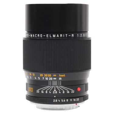Leica 100mm f2.8 Apo Macro Elmarit-R front three-quarter view with distance and aperture scales, hood extended
