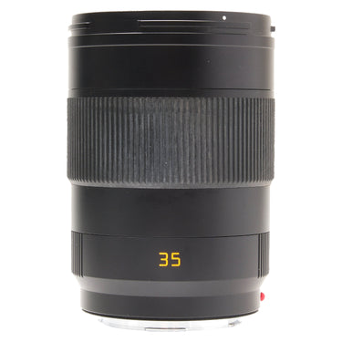 Leica APO-Summicron-SL 35mm f2 Asph lens standing upright, front three-quarter view