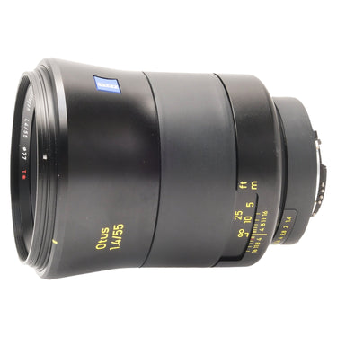 Zeiss Otus 55mm f1.4 side view showing yellow distance scale and Zeiss badge