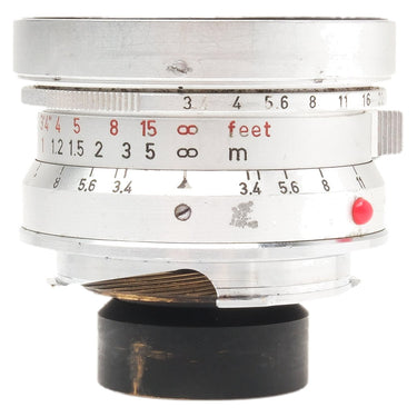 Leica 21mm f3.4 Super-Angulon side view showing aperture and focus scales with red index dot