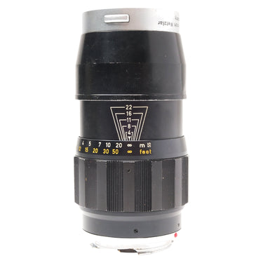 Leica 135mm f4 Tele-Elmar lens standing upright with hood, aperture index and distance scale