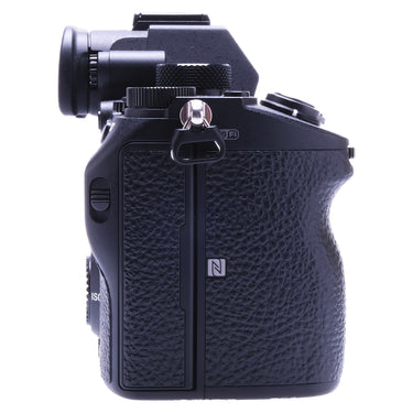 Sony A7 III right side showing grip, strap lug, and NFC mark
