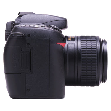 Nikon D80 with lens, left side showing memory card slot cover