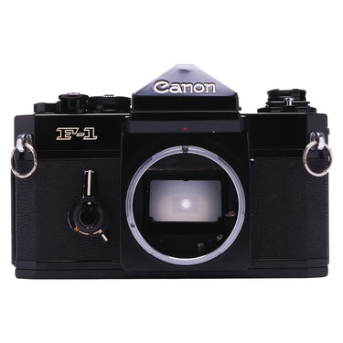 Canon F-1 black film SLR body front view with bare lens mount and mirror