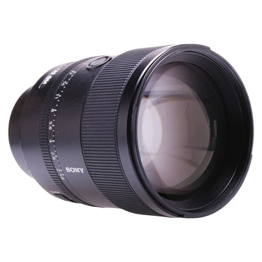 Sony FE 135mm f1.8 GM angled view of front glass and barrel markings