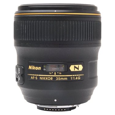 Nikon AF-S 35mm f1.4G prime lens standing upright, front nameplate and focus scale