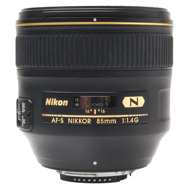 Nikon AF-S 85mm f1.4G lens top view with name plate, focus distance window, and gold N badge