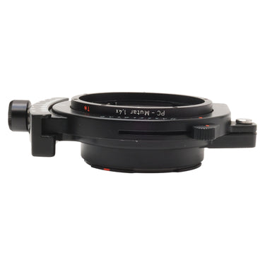 Hasselblad PC-Mutar 1.4x shift converter side view showing PC-Mutar 1.4x engraving and shift adjustment knob