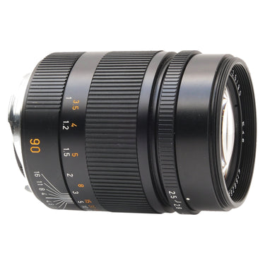 Leica 90mm Summarit-M side view showing focus scale and orange 90 marking