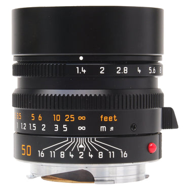 Leica 50mm Summilux-M f1.4 ASPH front view with built-in hood extended and aperture scale