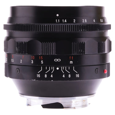 Voigtlander Nokton 50mm f1.1 side view showing aperture and depth of field scales with hood mounted