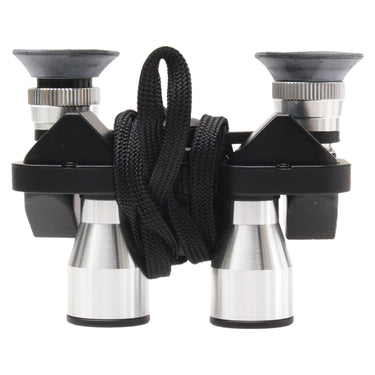 Minox BD 6x20 CP compact binocular side view with eyecups up and lanyard wrapped around