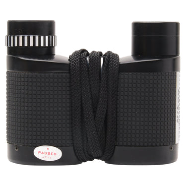 Nikon 6x18 Compact binocular side view with diopter ring, lanyard and passed sticker
