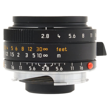 Leica 28mm f2.8 Elmarit-M Asph side view showing aperture and distance scales with red mount index