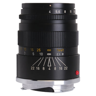 Leica 90mm f4 Elmar-C front three-quarter view showing aperture scale and depth of field markings