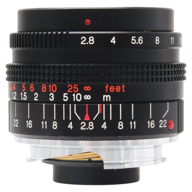 Konica 28mm f2.8 M-Hexanon lens front three-quarter view with aperture and depth of field scales, bare mount